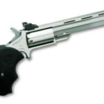 Long-barreled flare gun with a black ergonomic grip photographed at an angle.