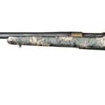 Camouflage-pattern bolt-action hunting rifle with a long barrel and a dark stock, laid out horizontally.