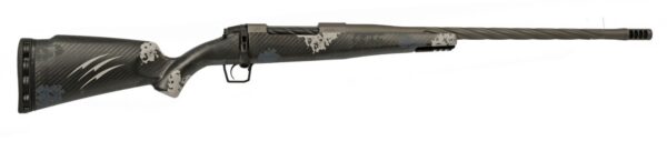 Camouflaged long-barrel rifle with a muzzle brake, shown in profile from the left.