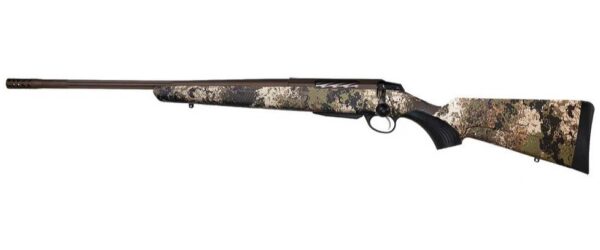 Bolt-action hunting rifle with a camouflage-pattern stock and long barrel, shown from side. It’s a scoped-looking rifle with a black butt pad and curved trigger guard.