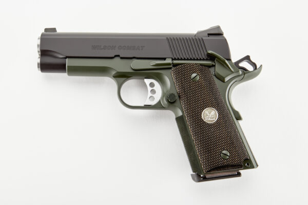 Semi-automatic pistol with green frame and checkered brown grip, Wilson Combat branding on the slide.