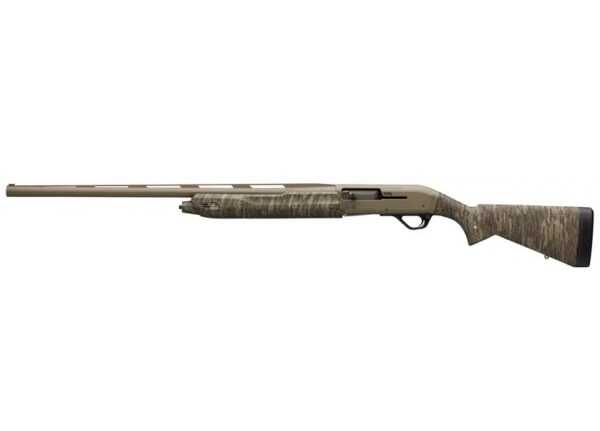 Camouflage-patterned shotgun shown in profile with long barrel and recoil pad at the stock side.