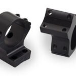 Two black rifle scope rings with screws on a white background, shown from two angles.